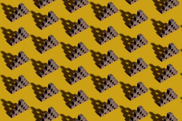 Abstract geometric pattern featuring pyramids creating shadows on a yellow background.