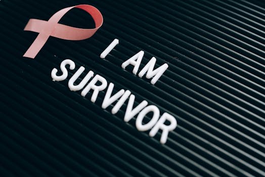 Breast cancer survivor message with pink ribbon and empowering text on board.